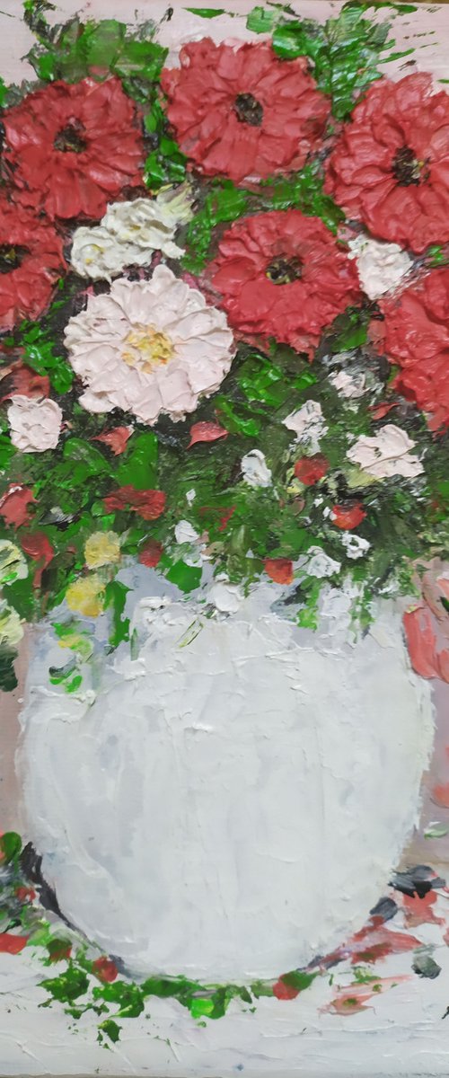 Red flowers in a vase by Maria Karalyos