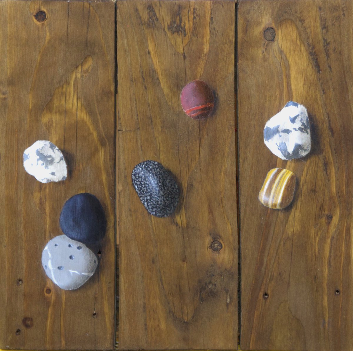Stones on recycled wood by Mike Skidmore