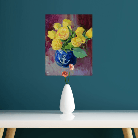 Yellow tulips in a blue vase on a purple background