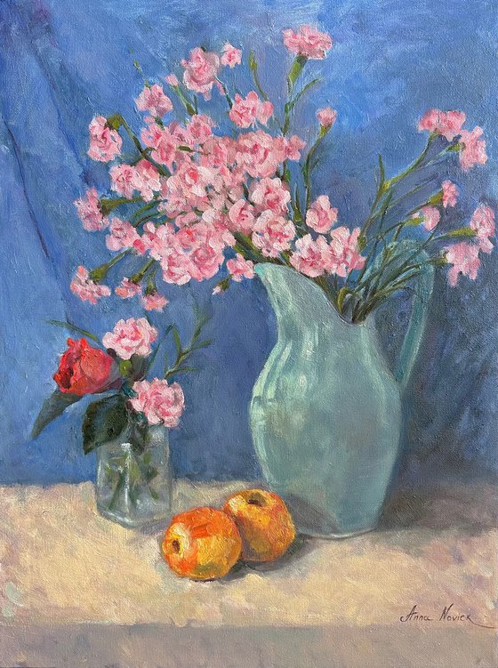Still life with carnation flowers and apples