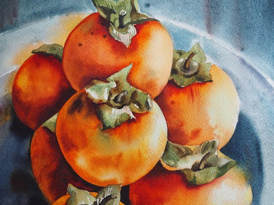 Still life with persimmons on plate