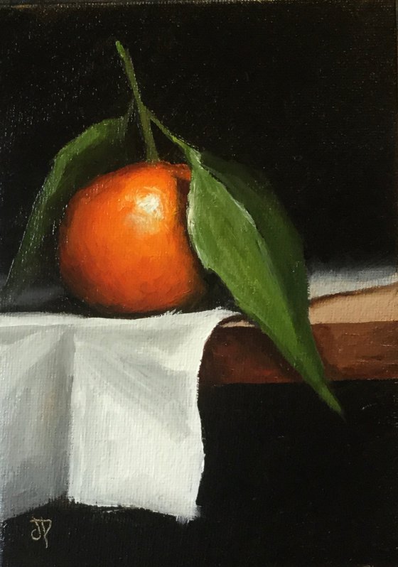 Clementine with leaf still life
