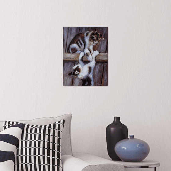 Playful Kittens on the Fence