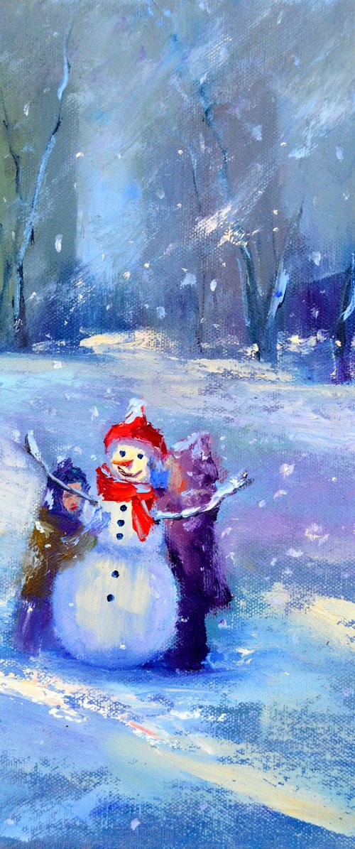 Snowy winter. Children make a snowman by Elena Lukina