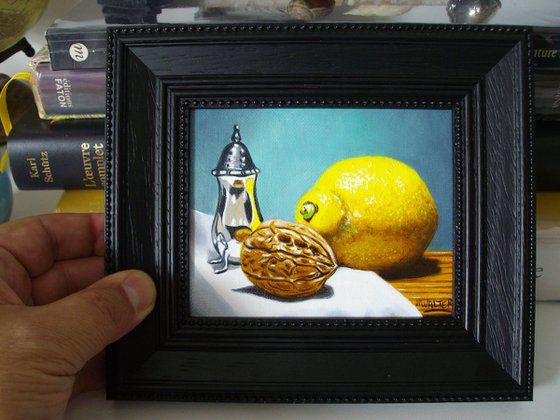 Lemon and walnut in silver