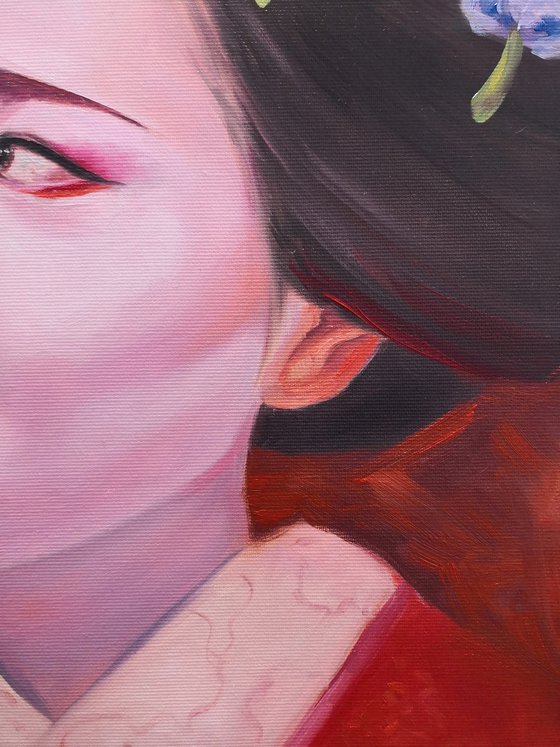 Portrait of Geisha in kimono in red colors