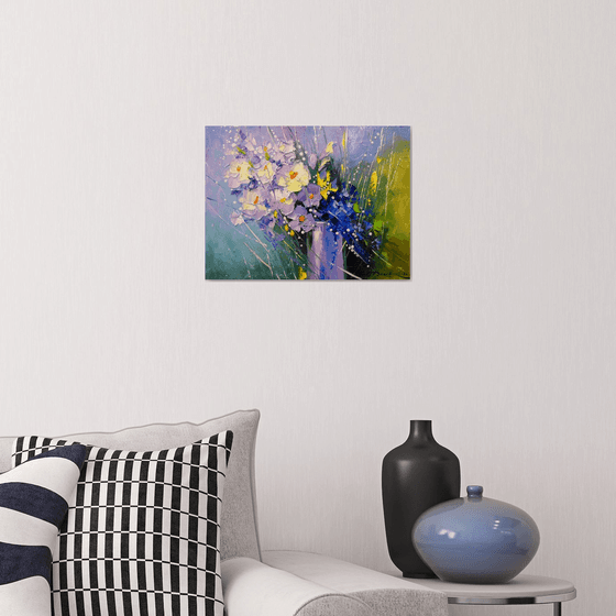 A bouquet of morning flowers in a glass