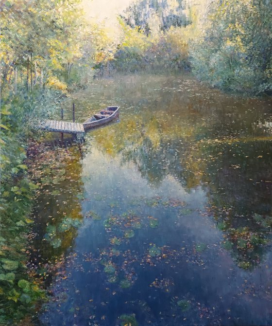 Autumn pond with boat. Time after sunrise