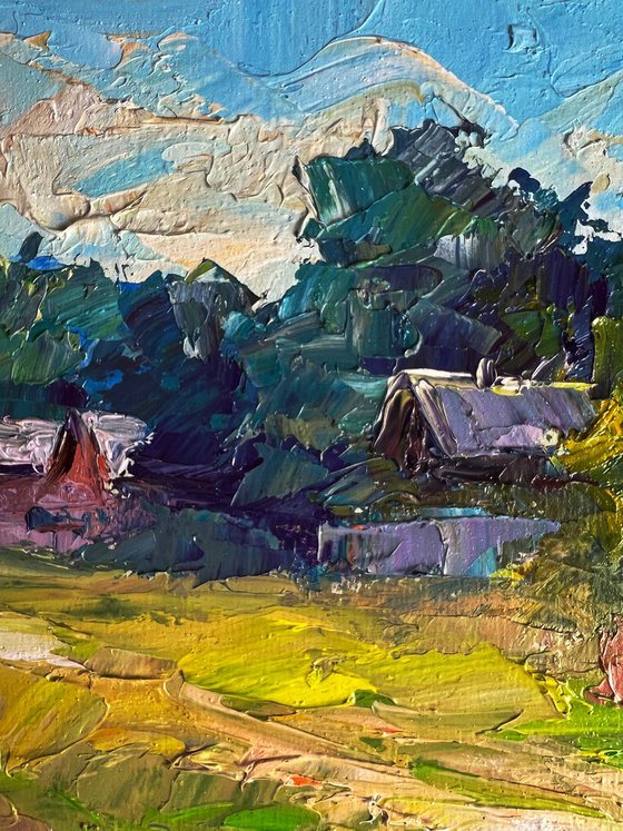 A Red Cow near the Houses
