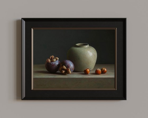 Mangosteens with a vase