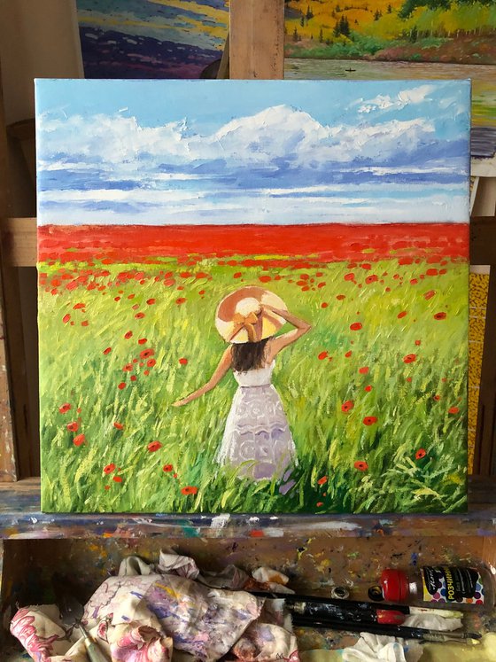 Women in poppy field