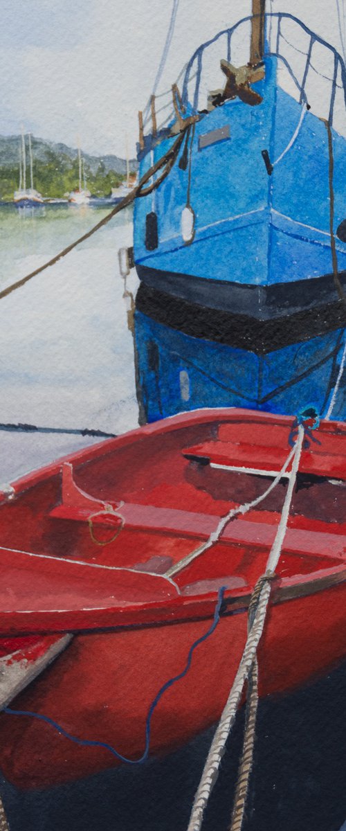 Red rowboat and blue trawler by Sue Cook