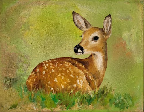 Bambi lies in the grass by Lisa Braun