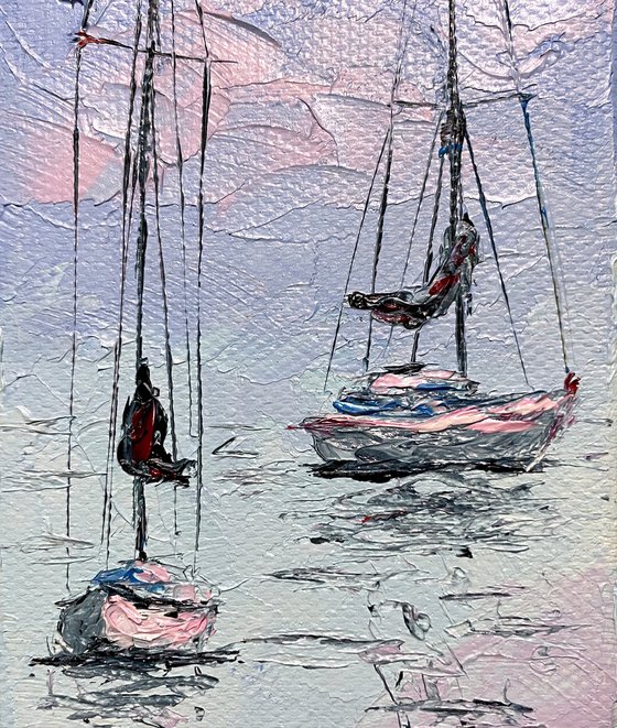 Sailboats at tender sunset