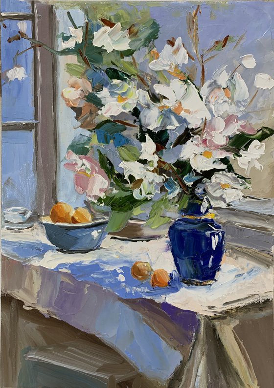 White flowers by the window