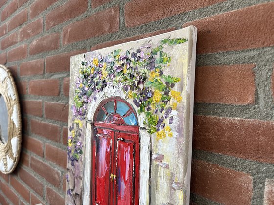 Red door with flowers