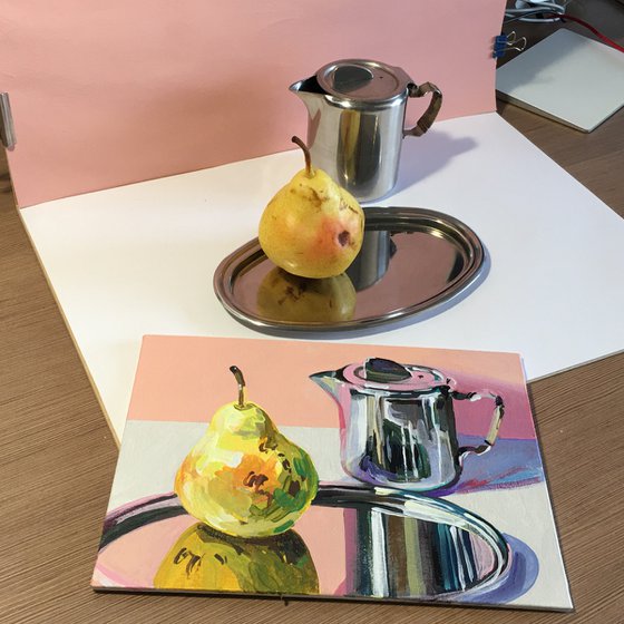 Metallic coffee pot and pear on a silver tray