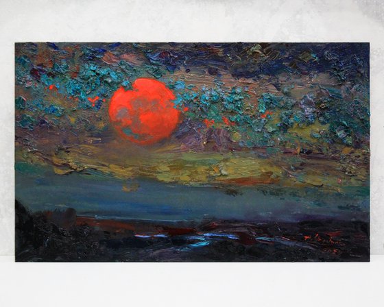 Red moon and clouds