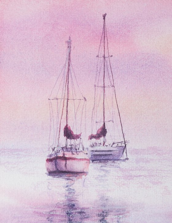 Sailboats on a pink sunset