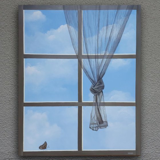 Window with a view of the clouds