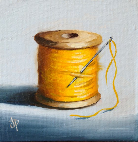 Little yellow cotton reel still life