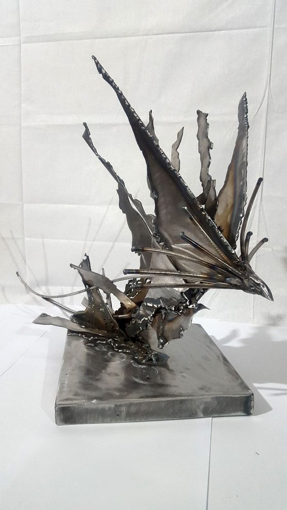 Brutalist welded iron sculpture star bird fueling the space around her  KLOSKA O romanian artist