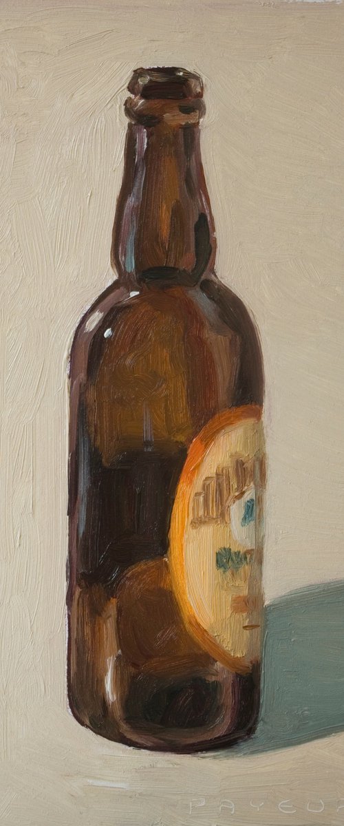 brown beer bottle by Olivier Payeur