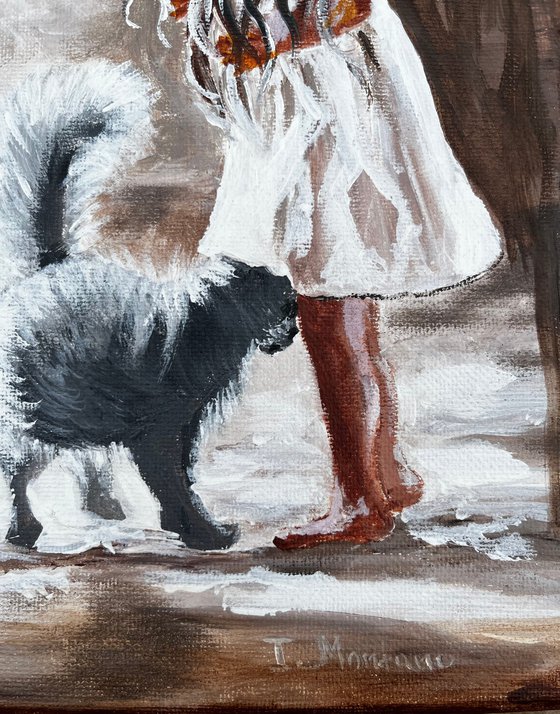 Little girl with a black cat.