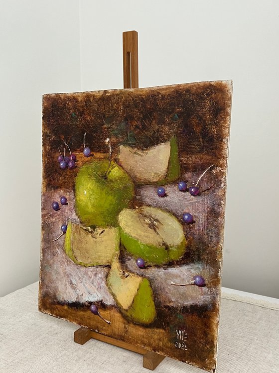 Green apples on dark