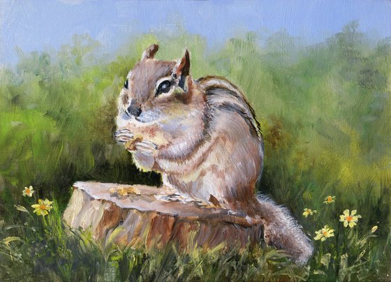 Cute chipmunk on a stump