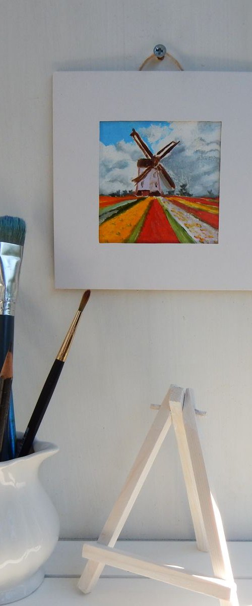 Tulip fields with wind mill in Holland. by Vita Schagen