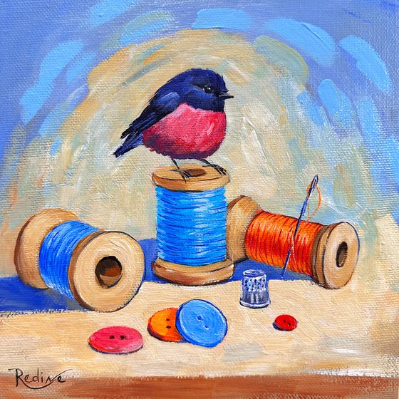 Pink Robin bird and thread spools