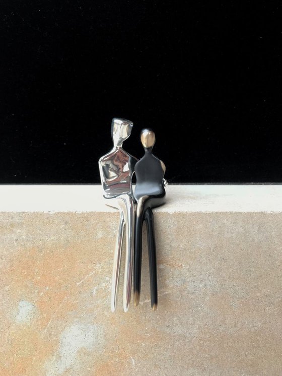 Mixed couple, Silver plated bronze and dark bronze with golden highlights