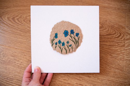 Blue flowers drawing on the author's craft paper by Rimma Savina