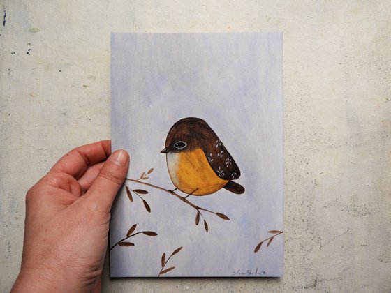 The small bird in brown