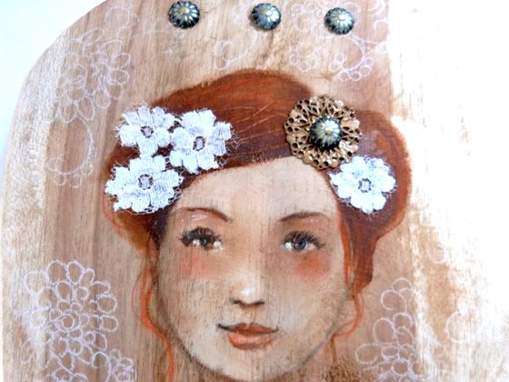 Tender Emilia on wood.