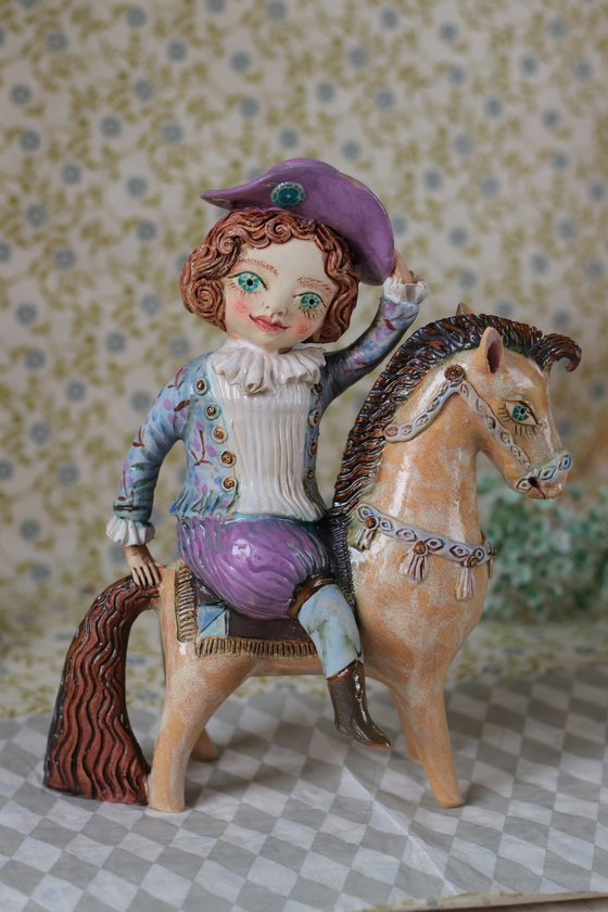 Vintage dressed boy riding a horse.