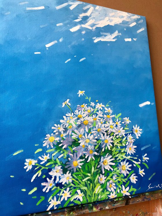 Blue sky with white flowers