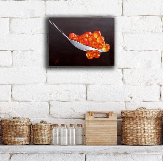 Red caviar in the spoon. Still life