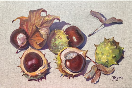 Chestnuts. Autumn leaves.