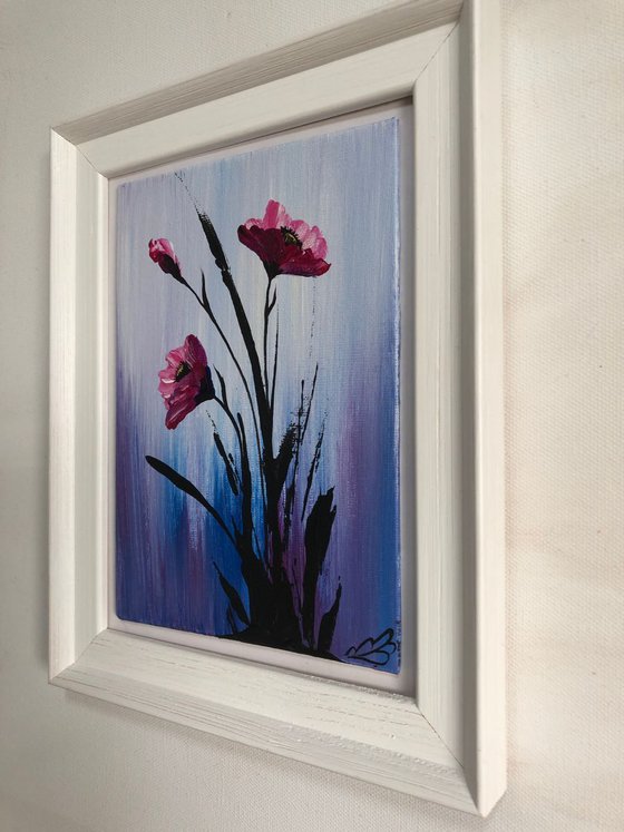 Pink poppies in a frame