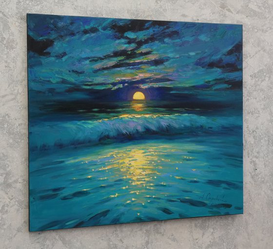 Moonrise in blue over sea