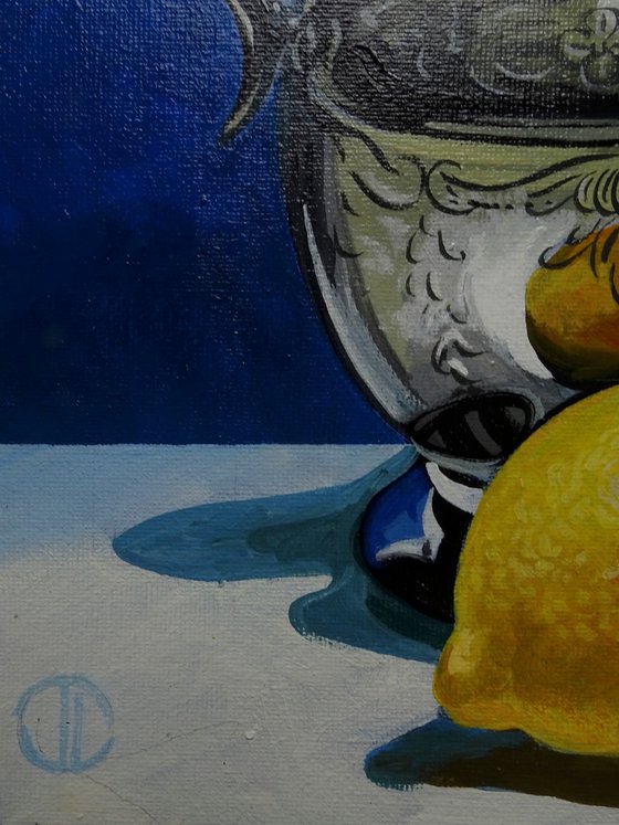 Still life water jug and lemons