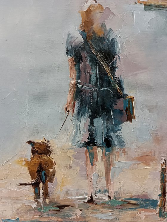 Woman walking with her dog. Street scene