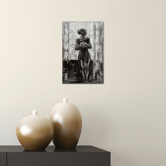 Black and white Woman with a cup of tea near the window