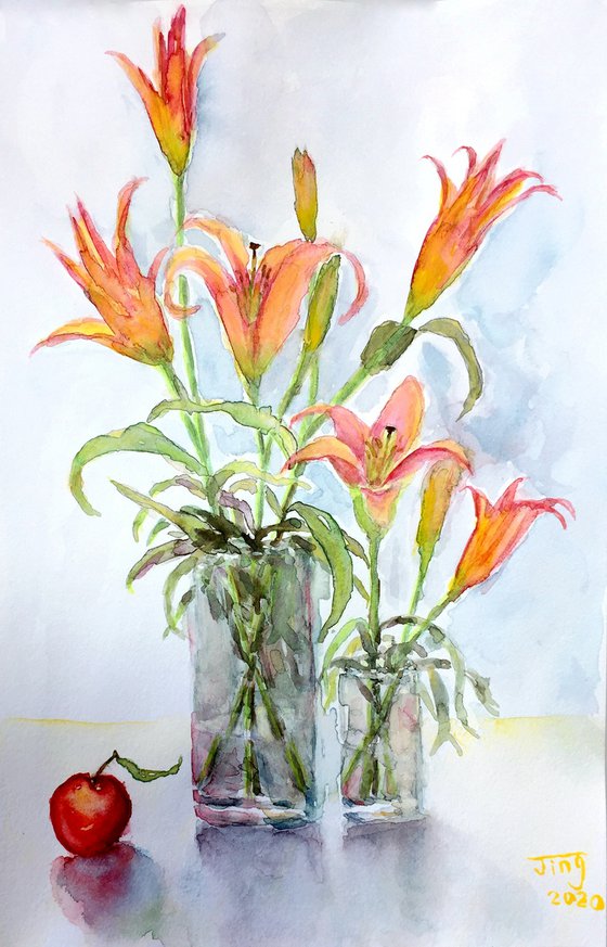 Lilies in vases with fruit
