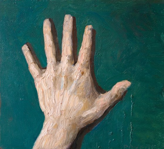 rough expressionist hand on green background