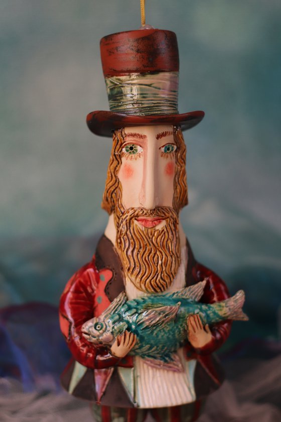 Gentleman holding a fish. Hanging sculpture, Bell-doll