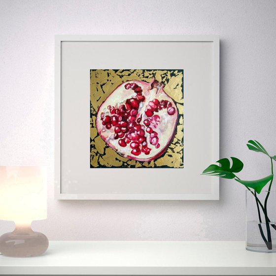 Pomegranate fruit in gold