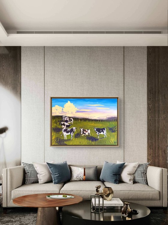Cows grazing in the field